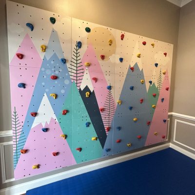 Mountain-themed climbing wall at All Bright Therapies West Town pediatric therapy clinic