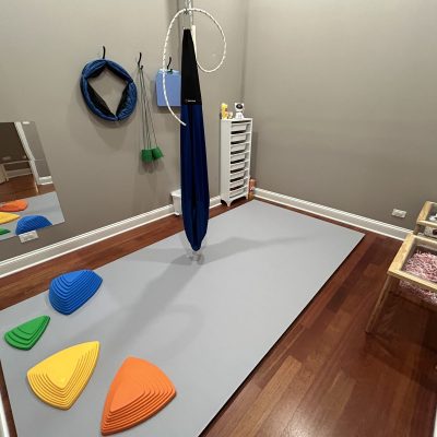 Colorful stepping stones in the pediatric therapy gym at All Bright Therapies West Town